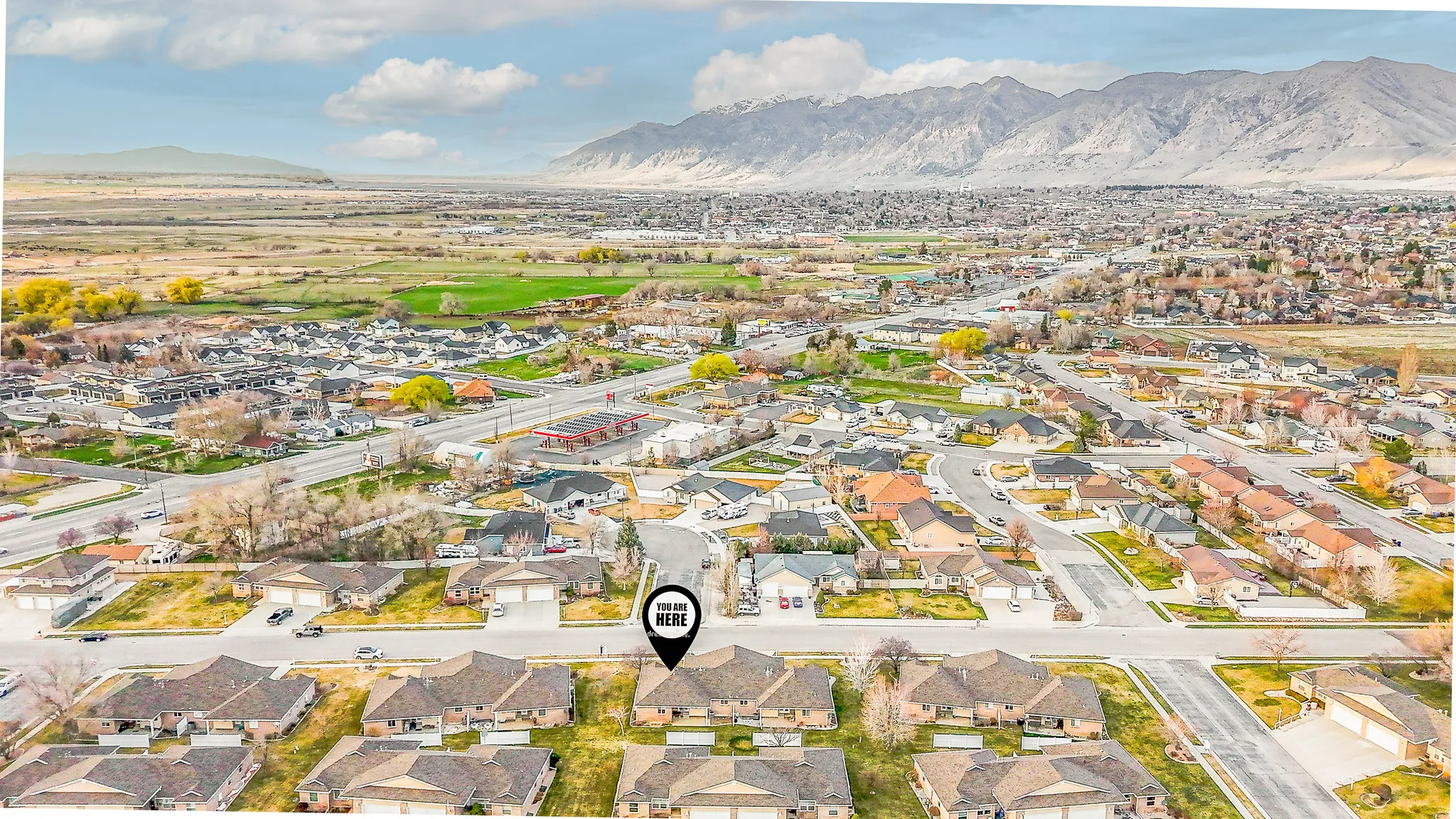 Aerial view of residential area featuring a mountain backdrop