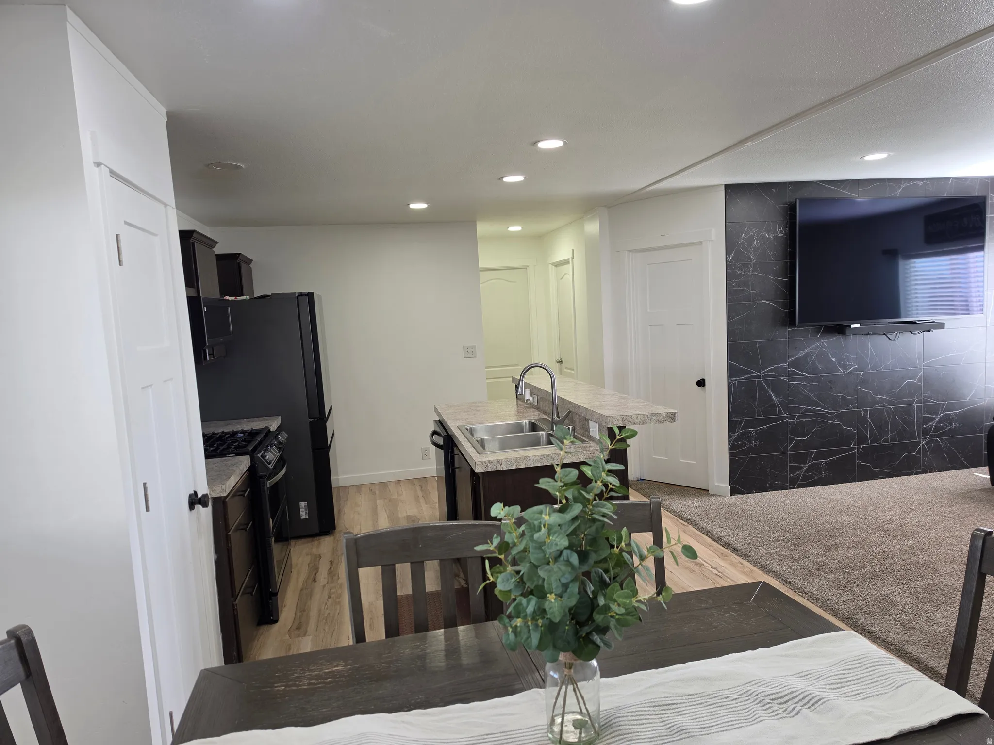 Dining space featuring light wood-style floors and recessed lighting