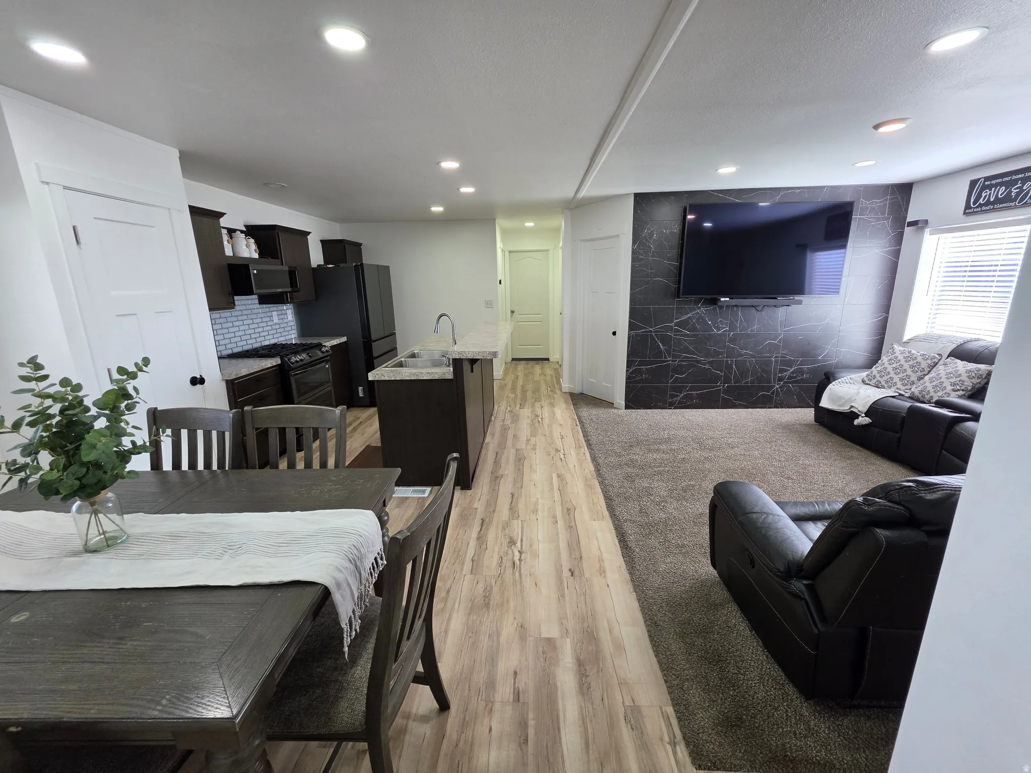 Dining space featuring light wood-style flooring and recessed lighting