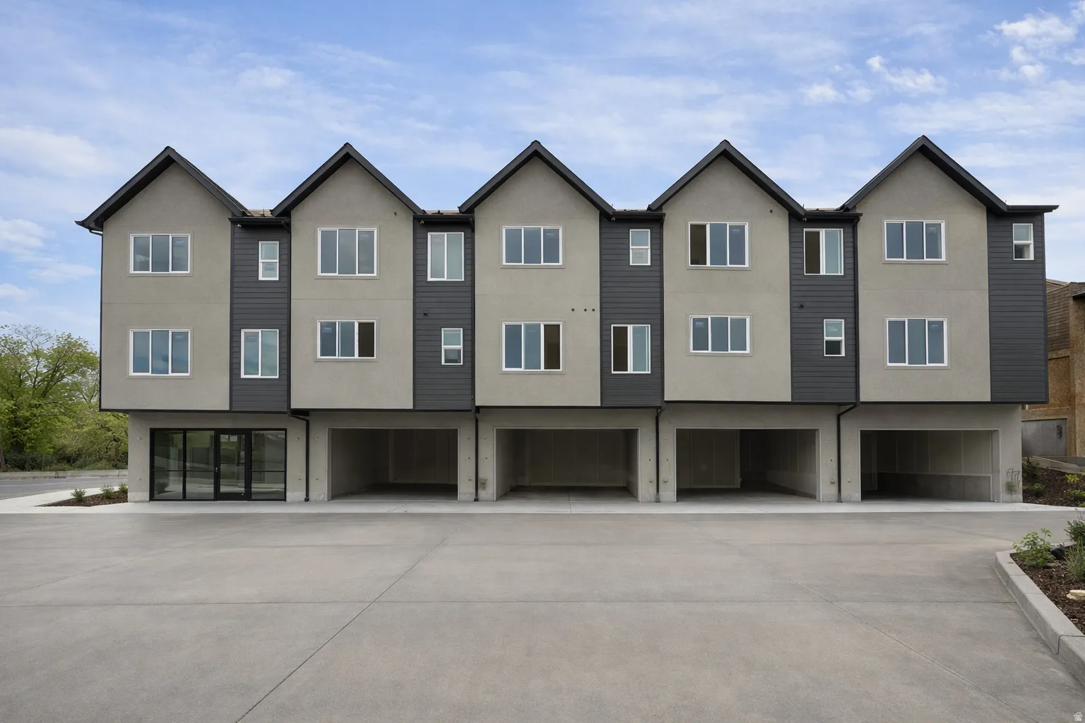 Contemporary house with stucco siding and an attached garage