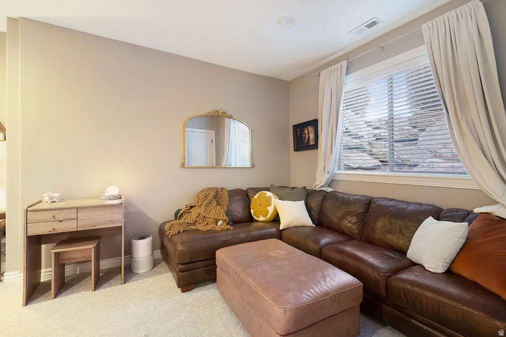Living room featuring carpet and baseboards