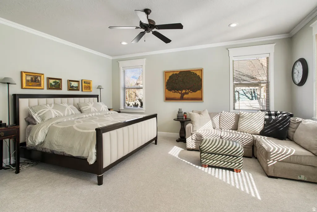 Bedroom featuring ornamental molding, carpet floors, a ceiling fan, and recessed lighting