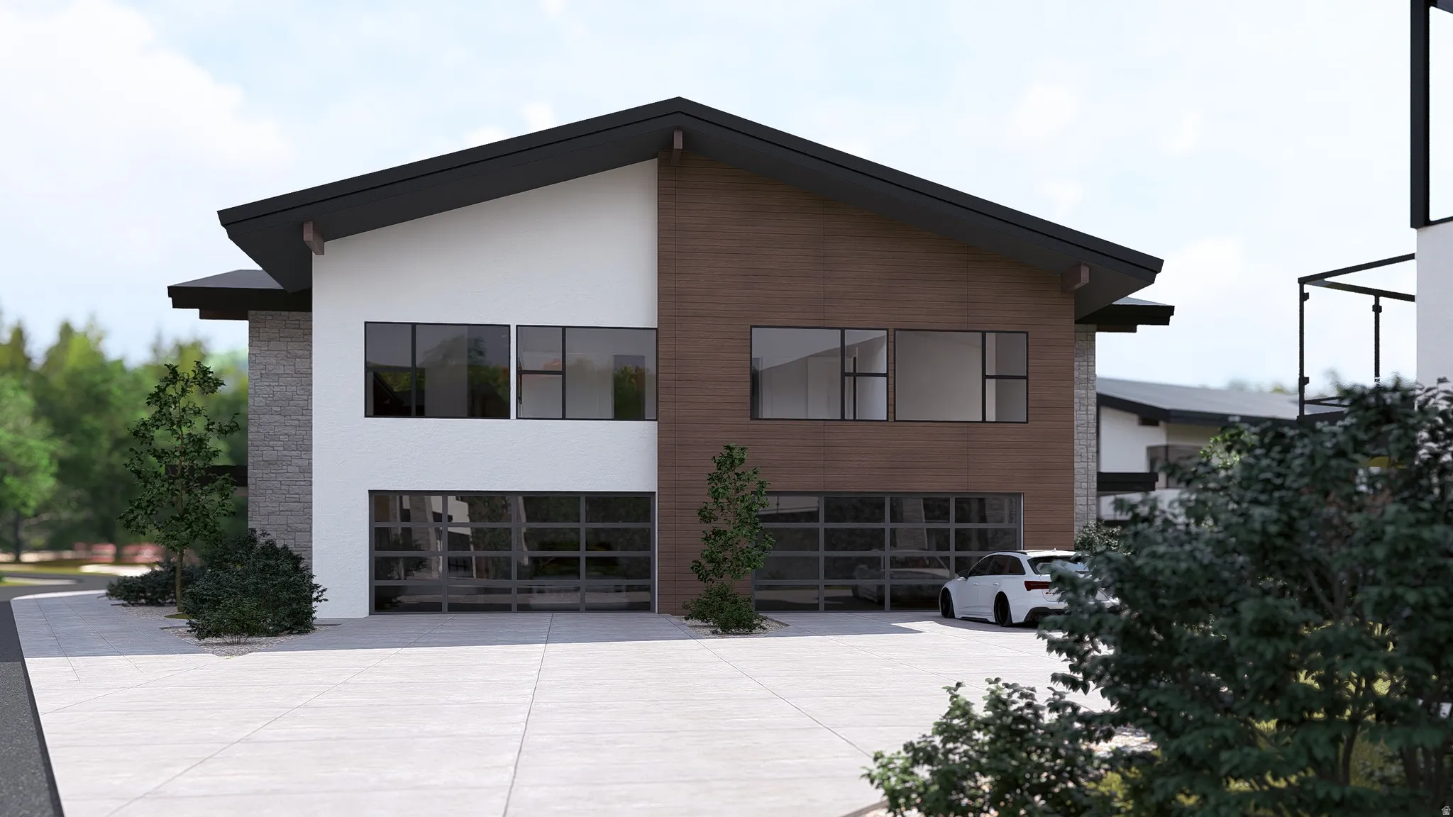 View of side of home with an attached garage, concrete driveway, and stone siding