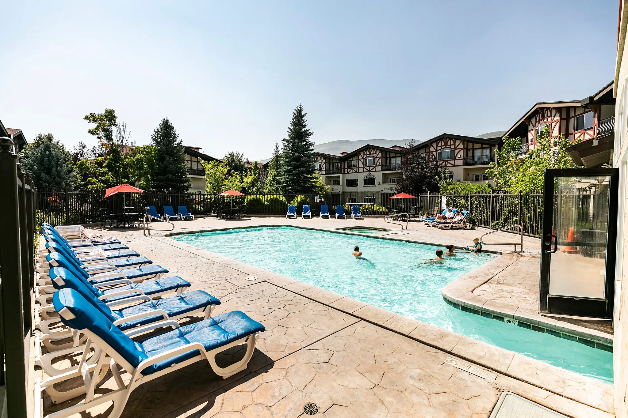 Community pool with a patio