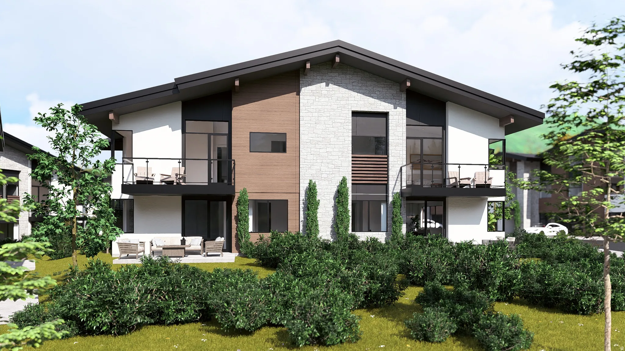 Back of house featuring a balcony, outdoor lounge area, stone siding, and stucco siding
