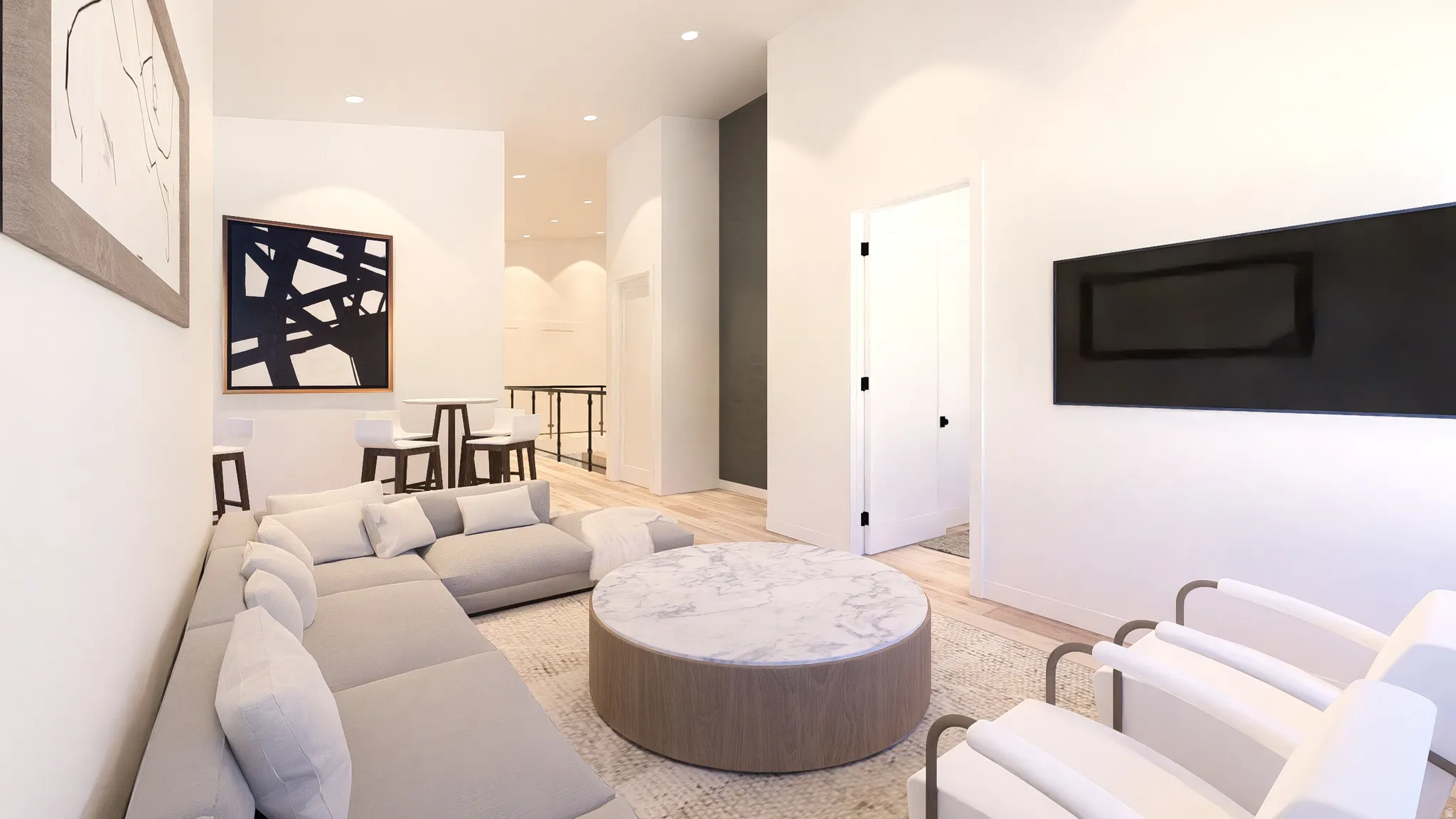 Living area featuring light wood finished floors, arched walkways, recessed lighting, and a high ceiling