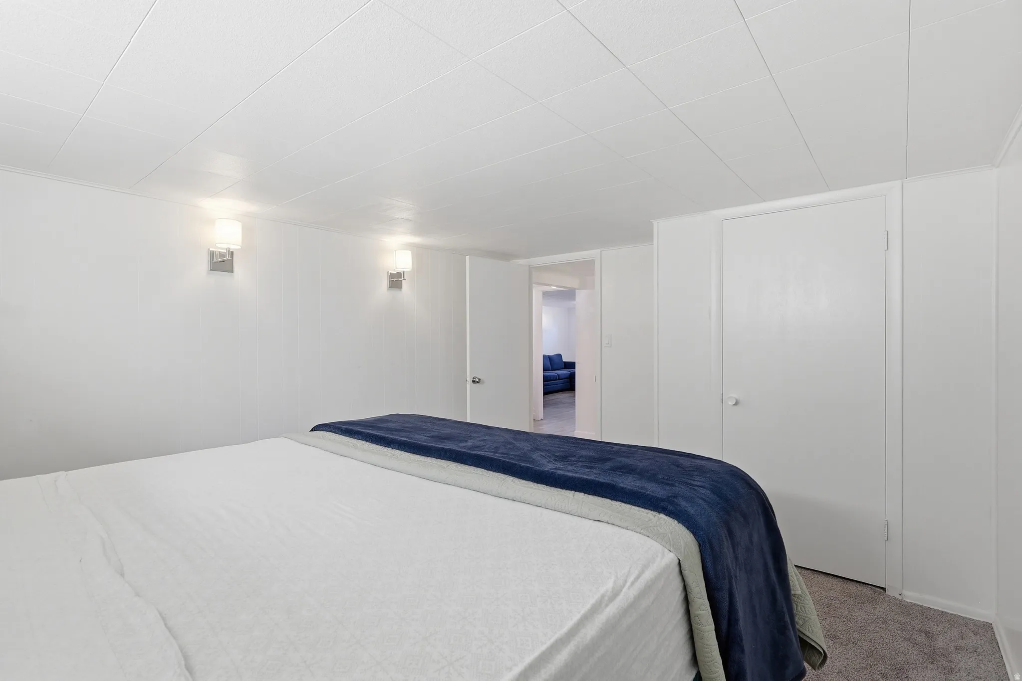 Bedroom featuring light colored carpet