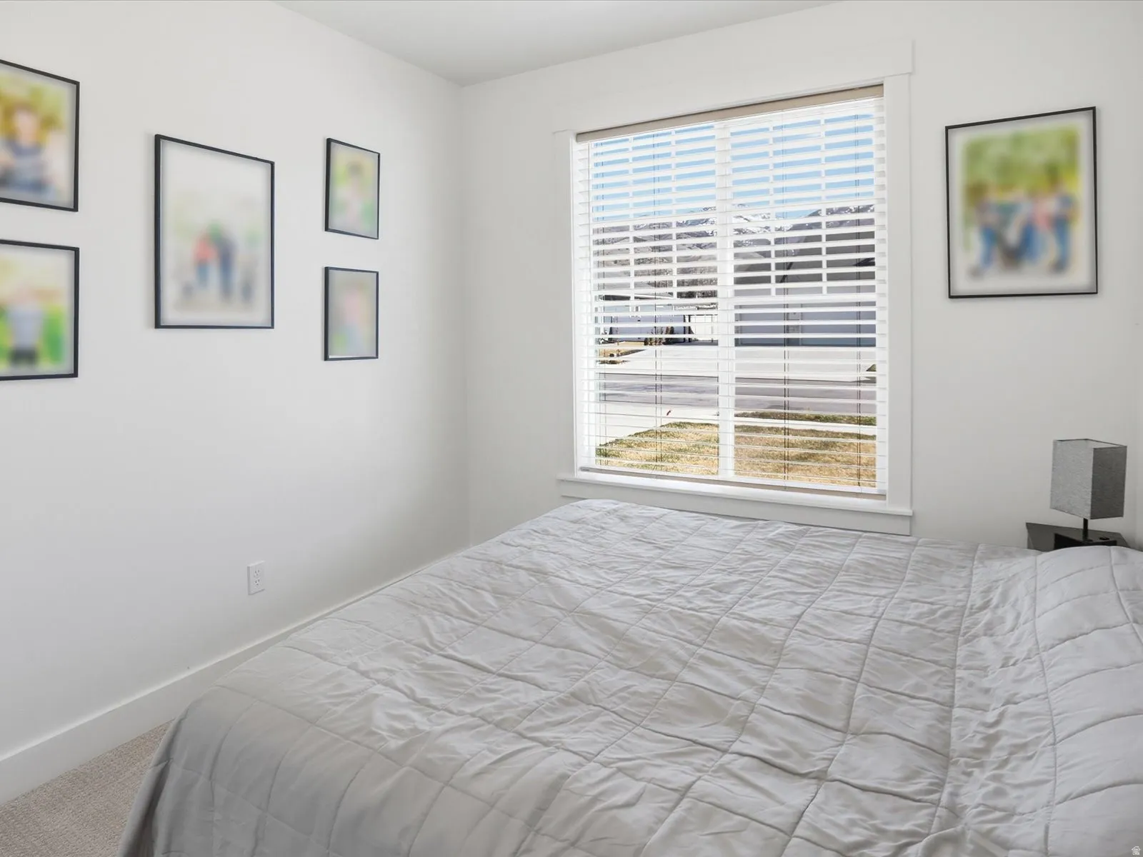 Carpeted bedroom featuring baseboards