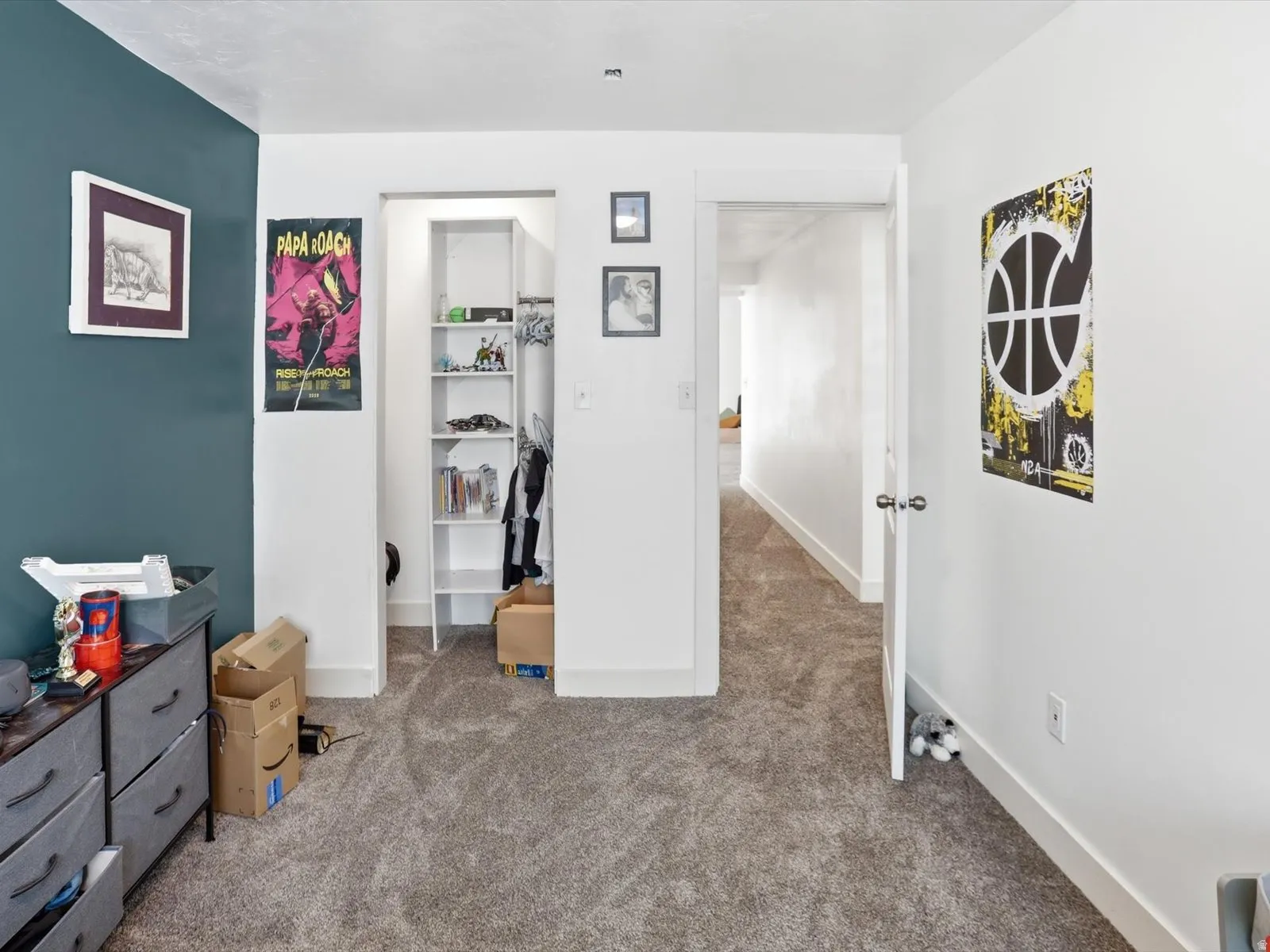 Bedroom featuring carpet floors and a walk in closet