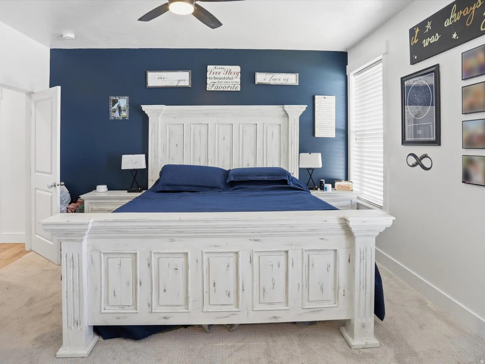 Bedroom with light colored carpet and ceiling fan