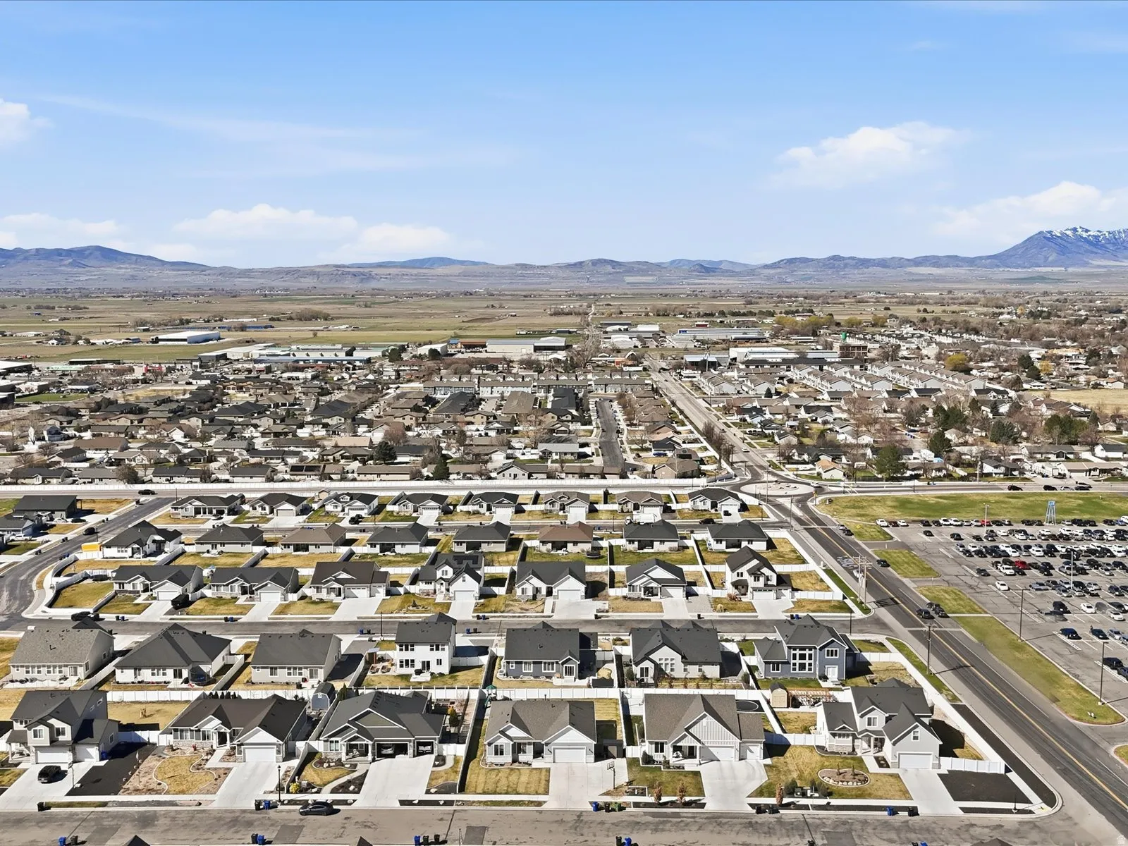 Aerial view of residential area featuring a mountain backdrop