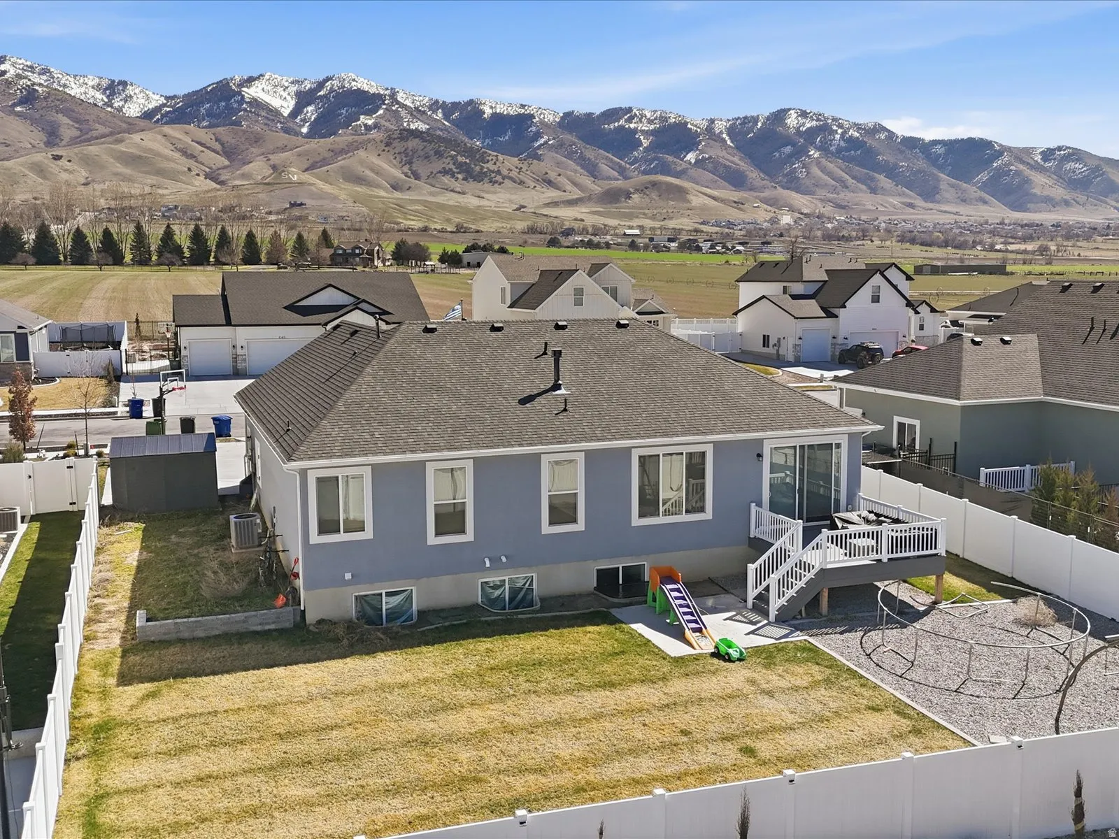 Aerial perspective of suburban area with a mountainous background