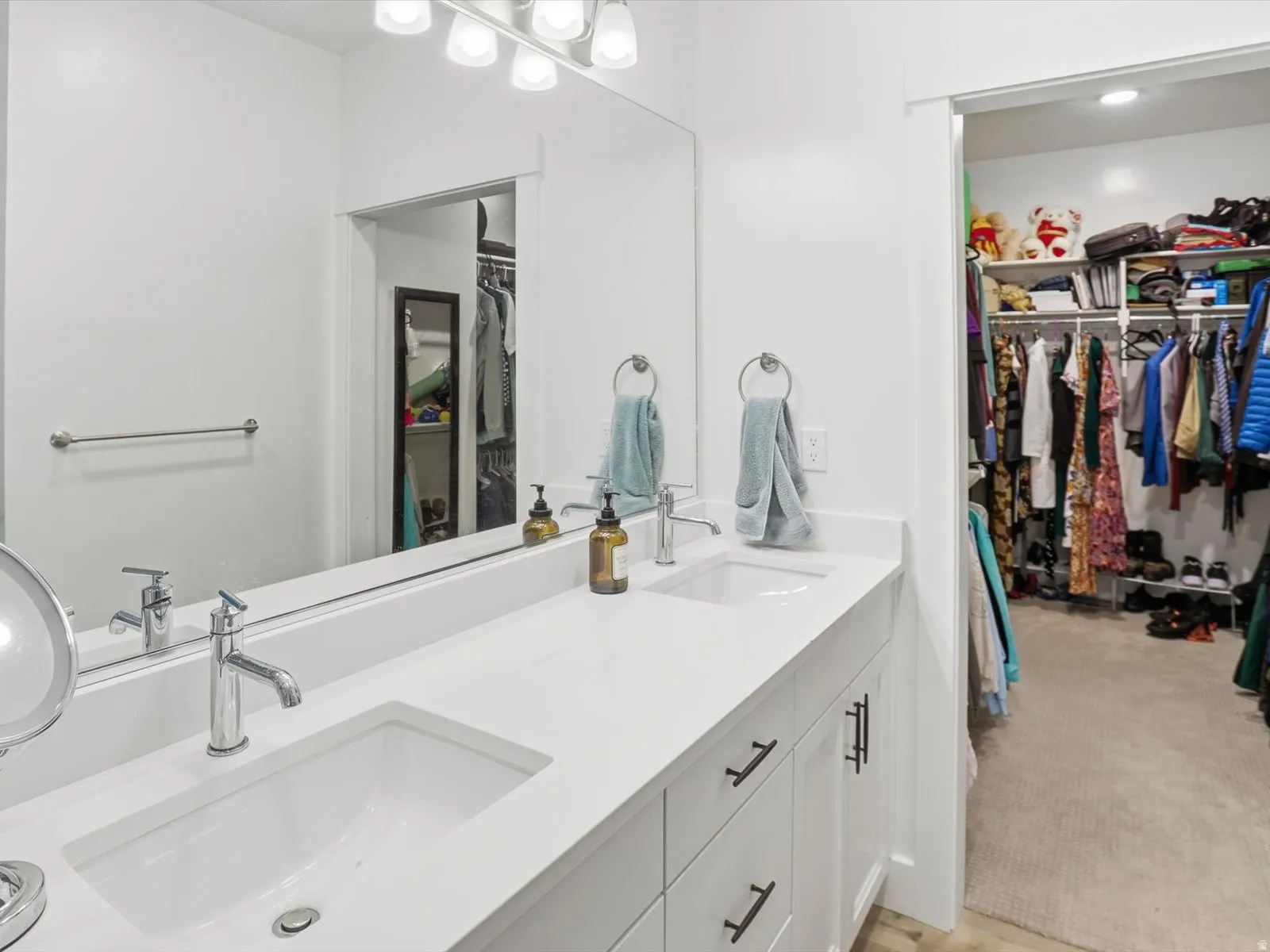 Bathroom with a spacious closet and double vanity