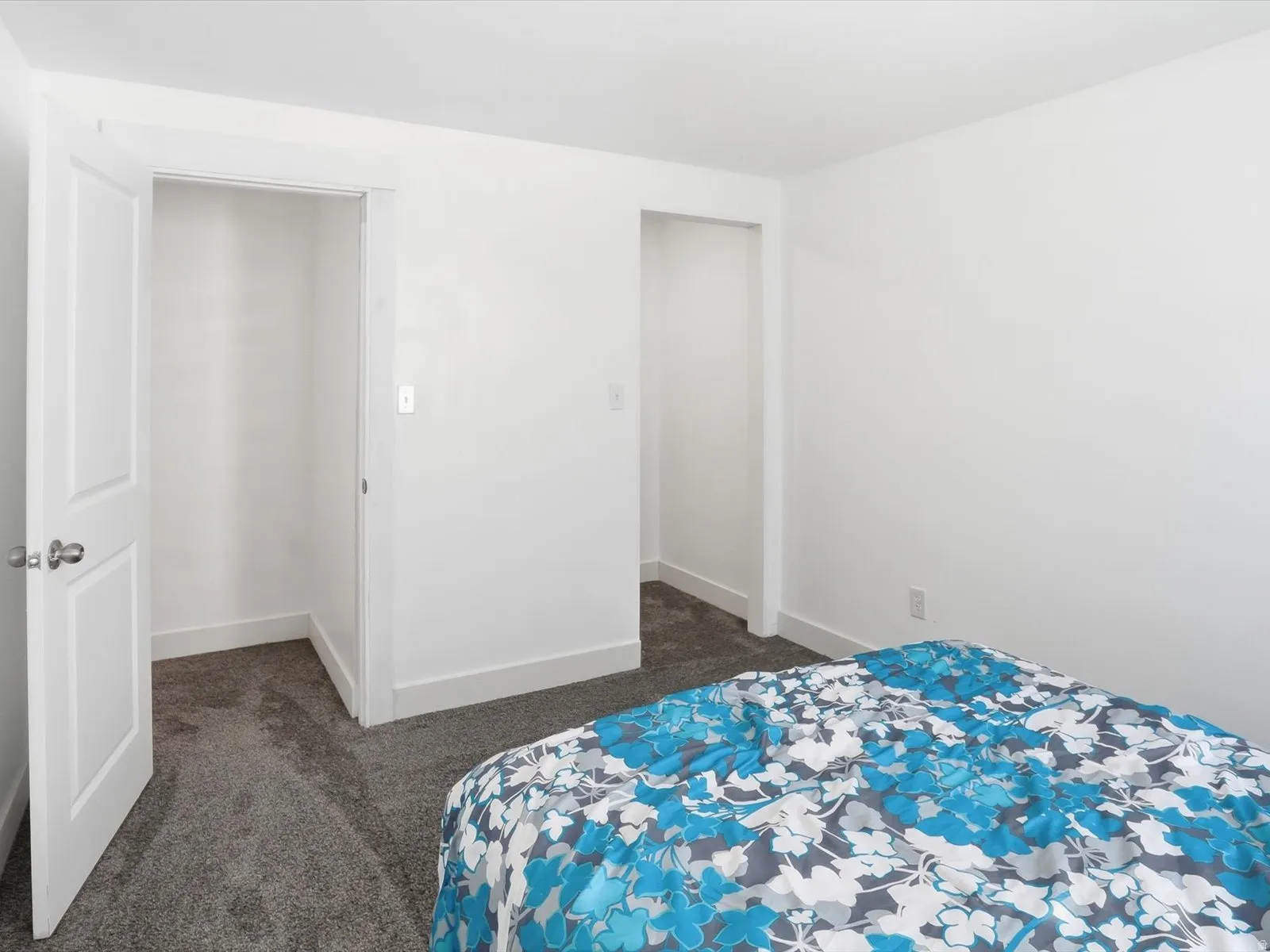Bedroom with dark carpet