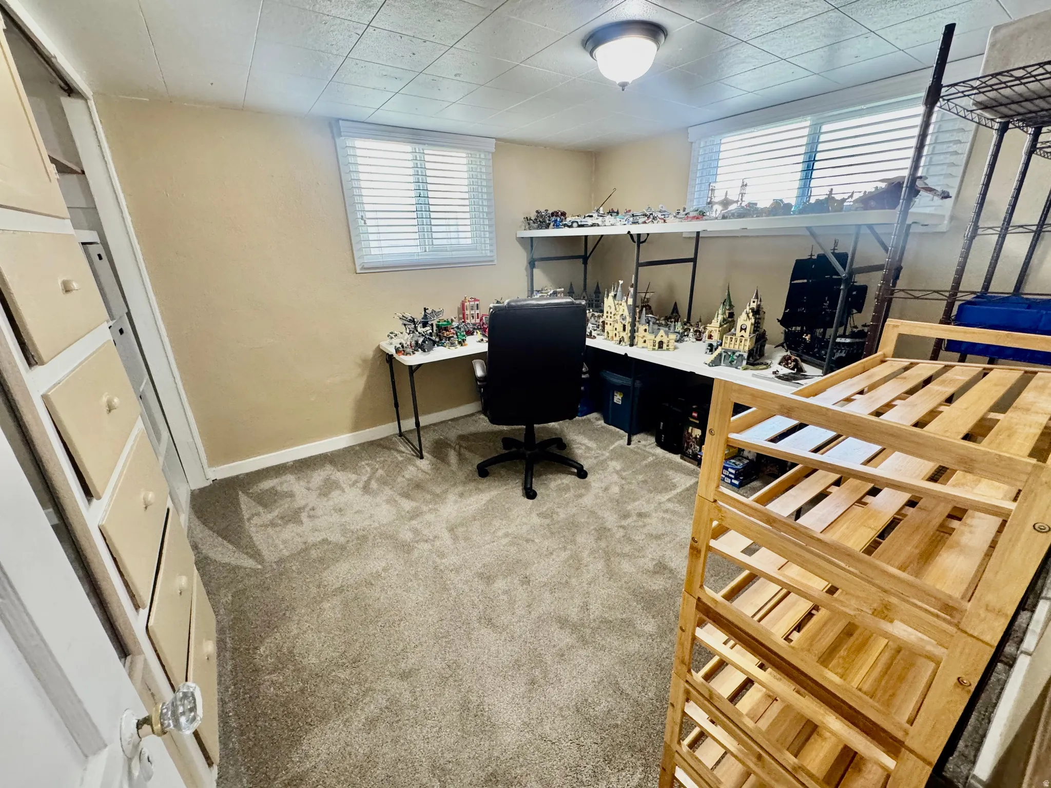 Carpeted office with baseboards