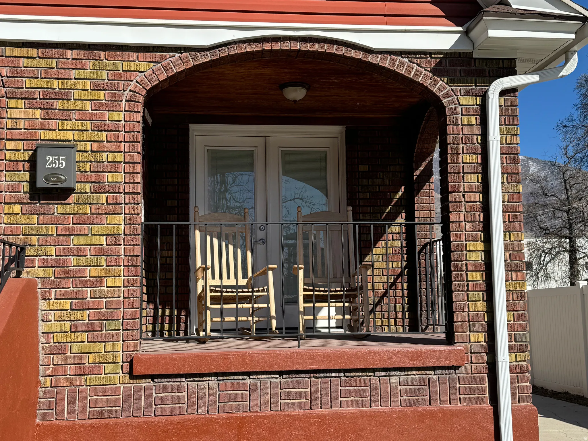 Entrance to property with brick siding and french doors