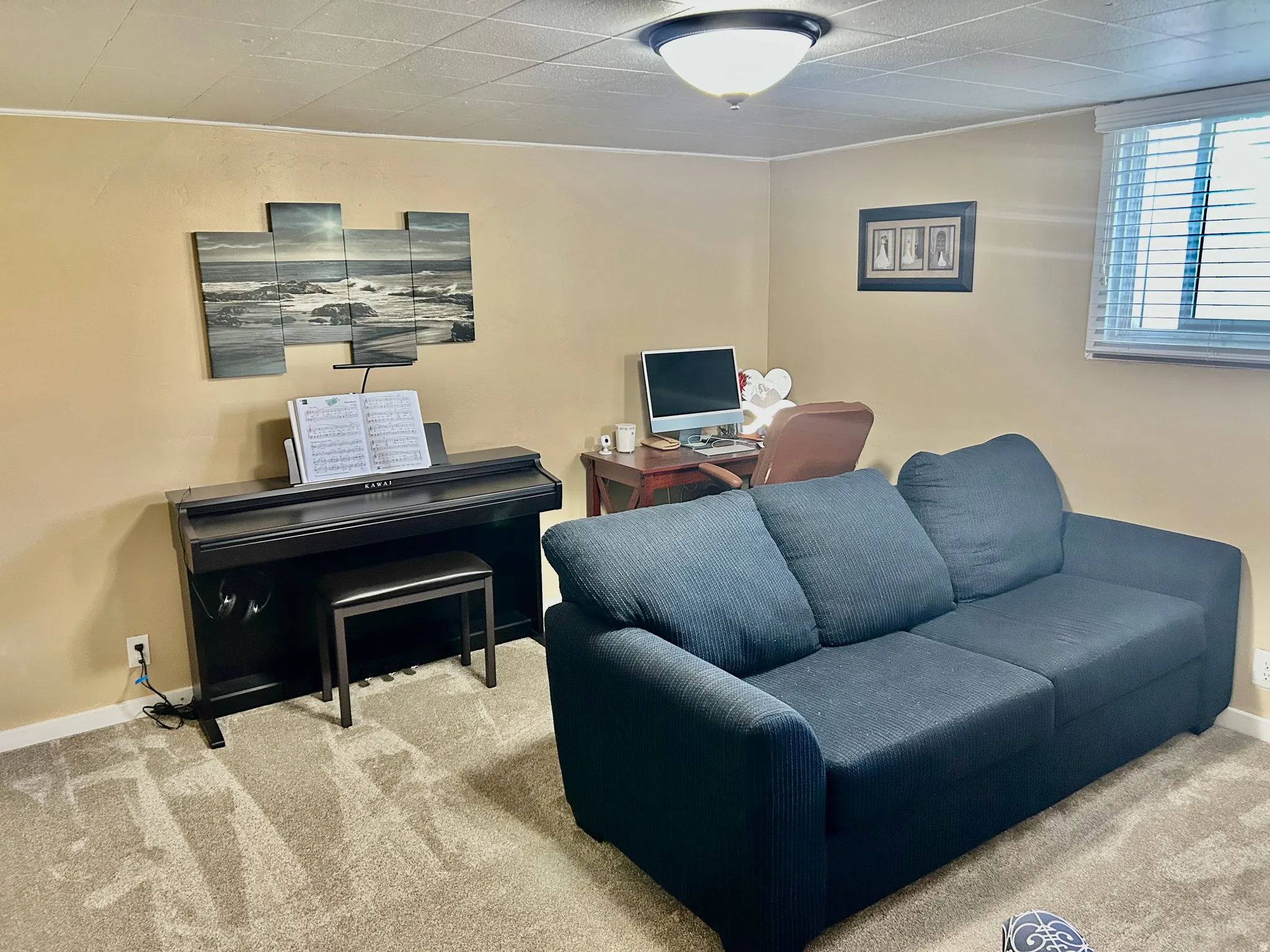 Office area featuring light carpet and baseboards