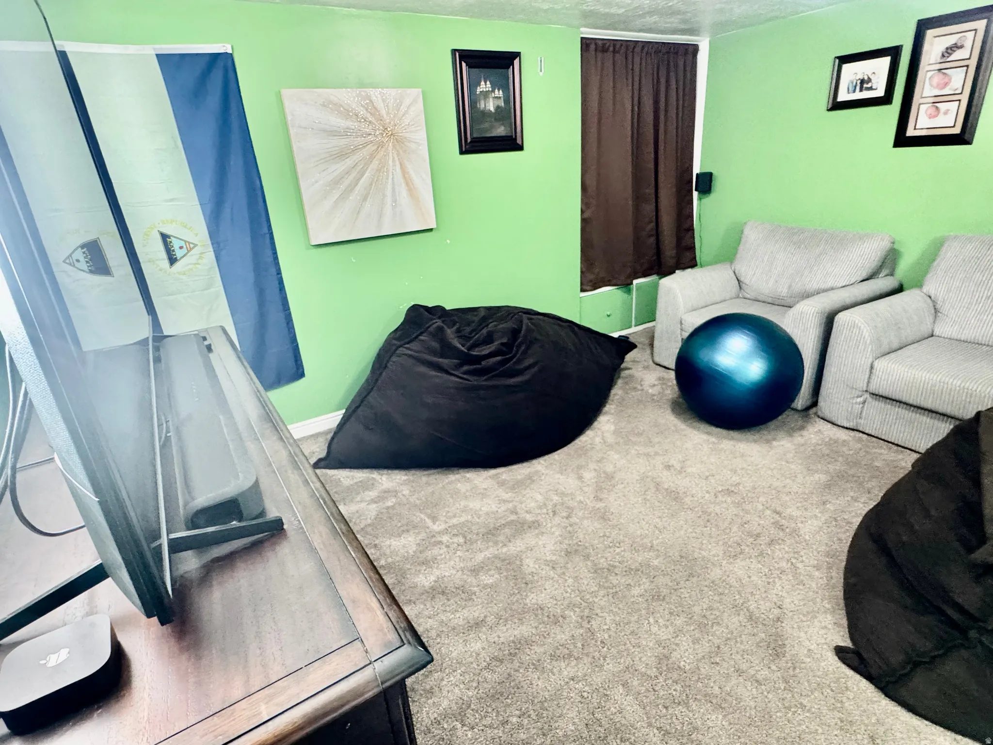 Living room featuring carpet flooring and baseboards