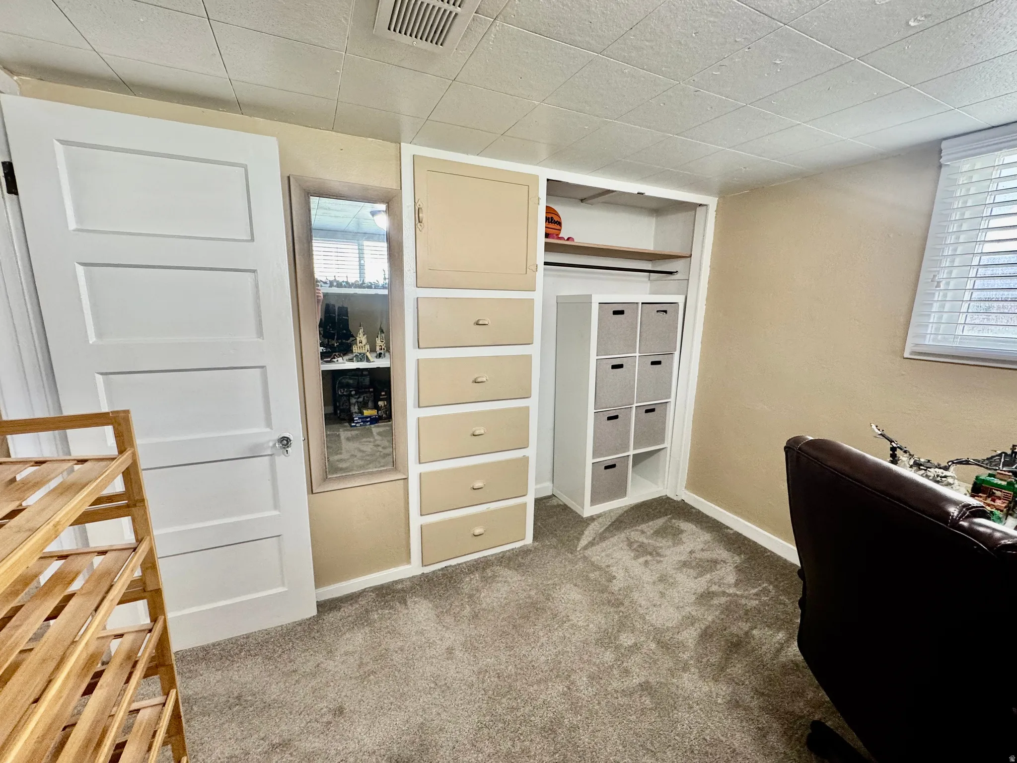 Office area with light colored carpet and baseboards