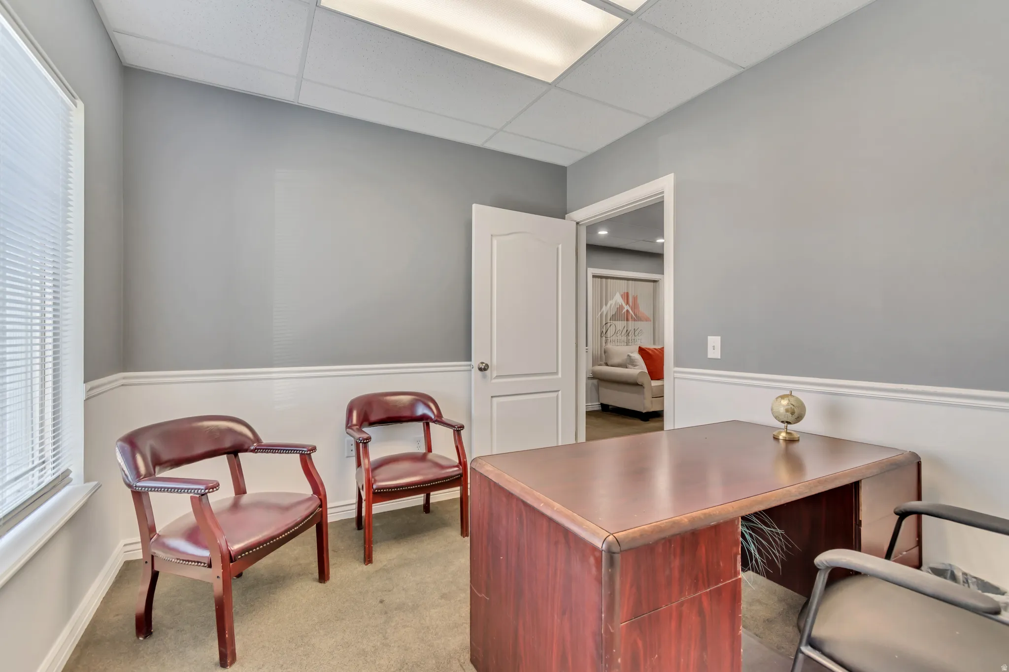Home office with a paneled ceiling