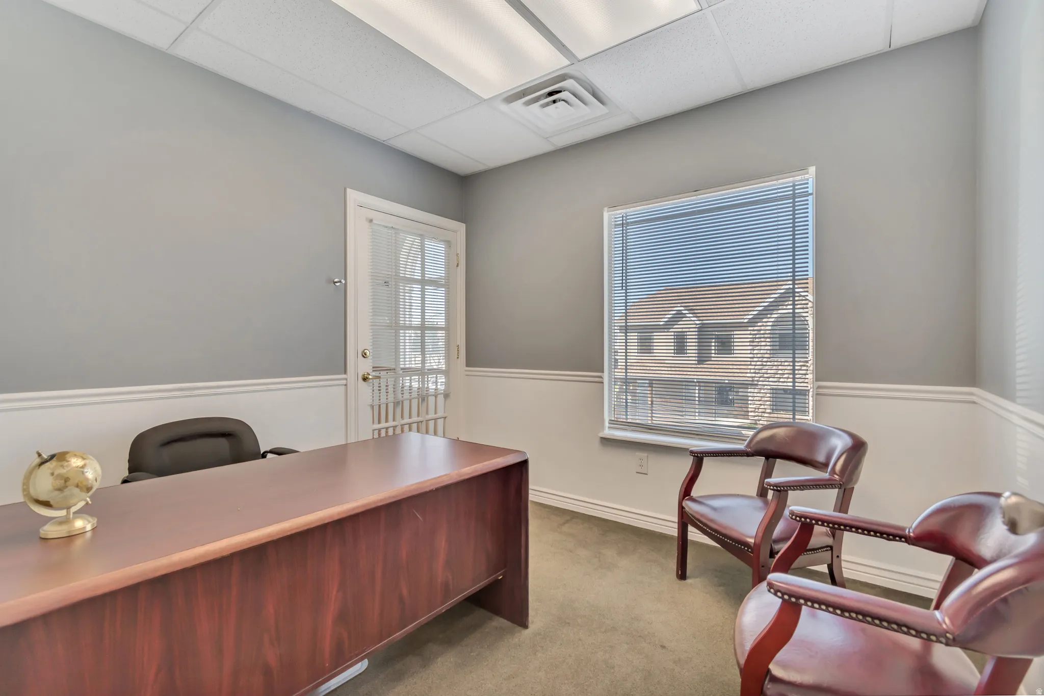 Office space featuring a drop ceiling