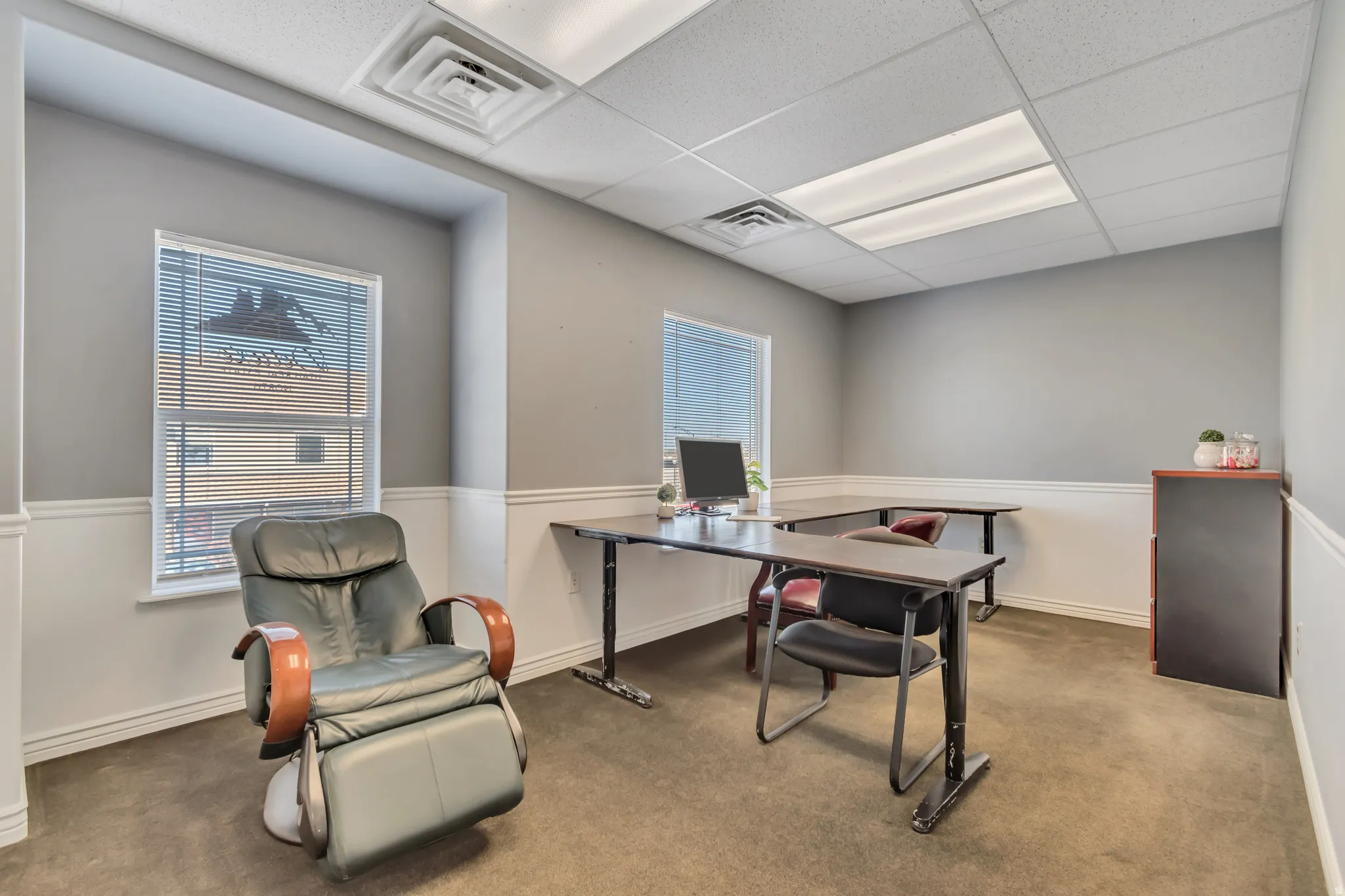 Office featuring a drop ceiling