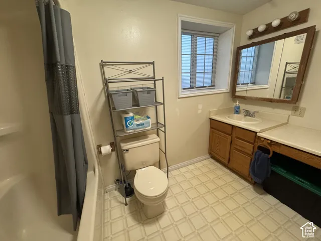 Bathroom featuring vanity and light flooring