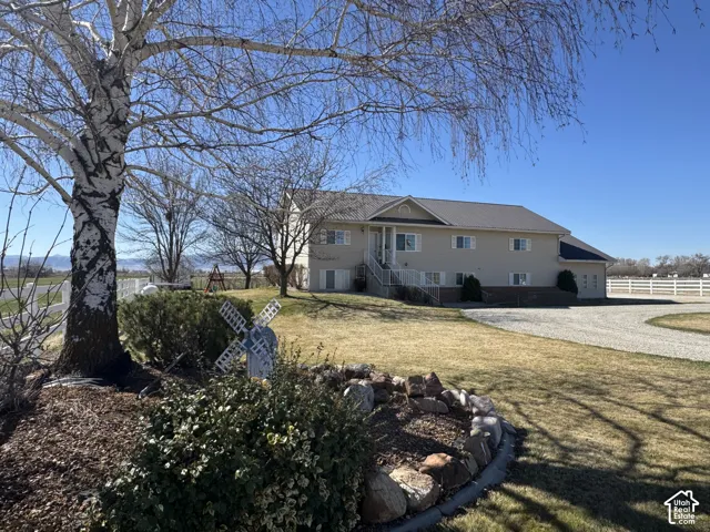 View of side of home with driveway
