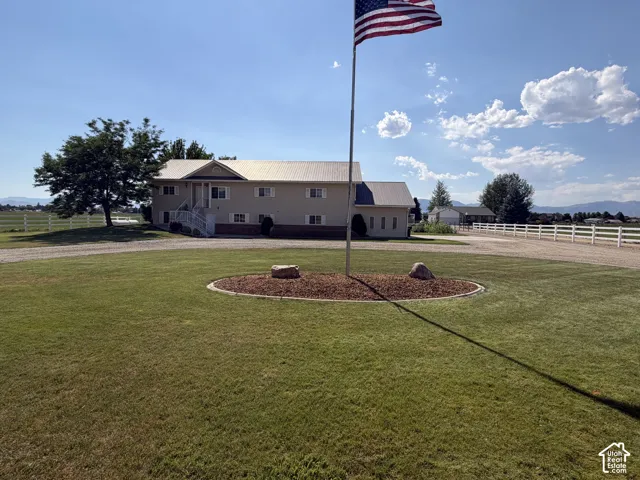Expansive green lawn with a circular mulched bed