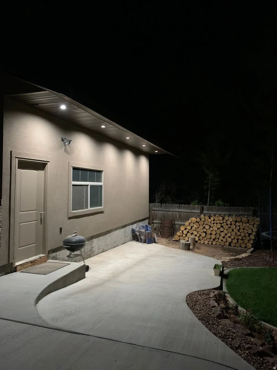 Patio at twilight with a patio and grilling area