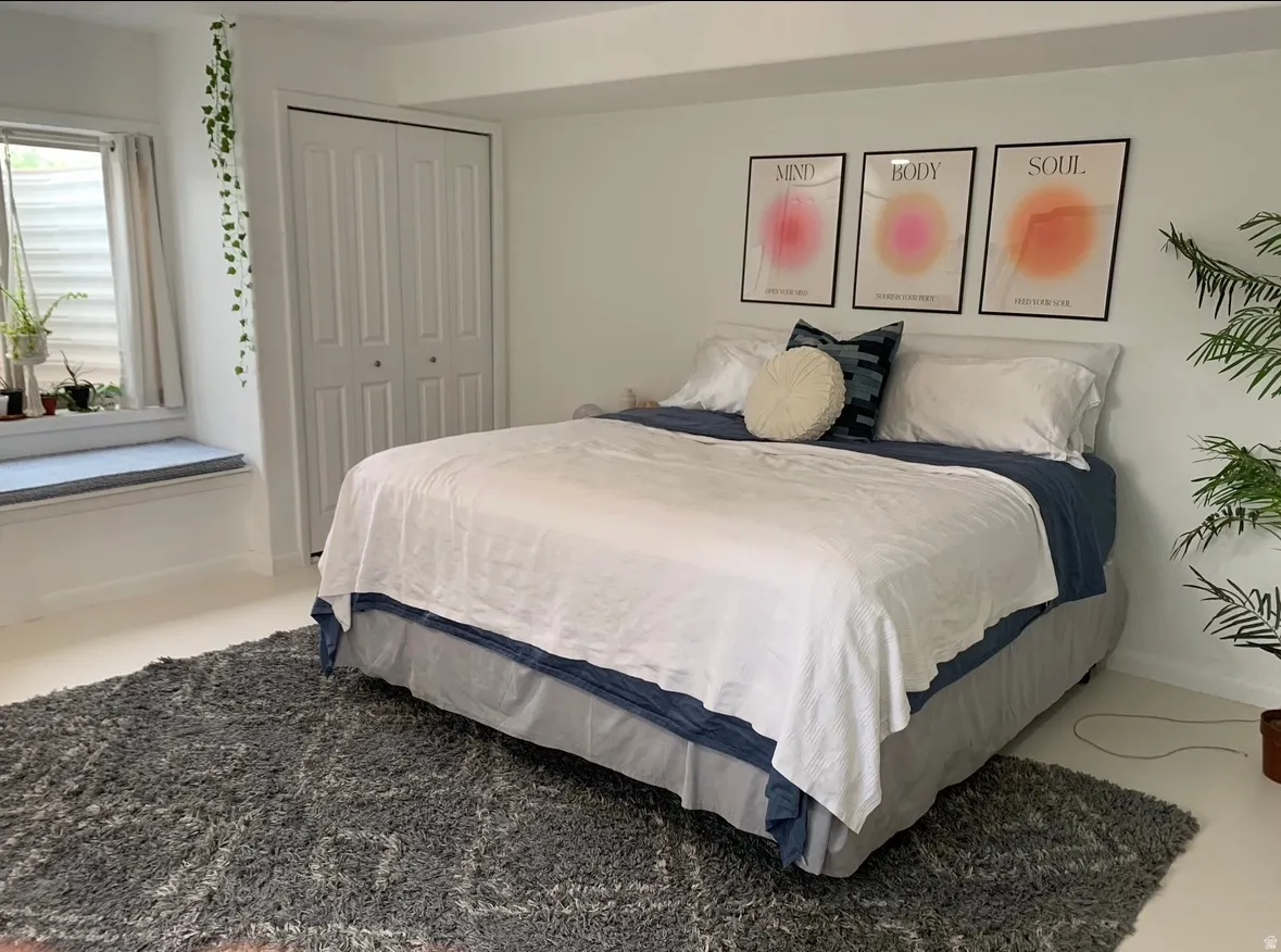 Bedroom featuring a closet and baseboards