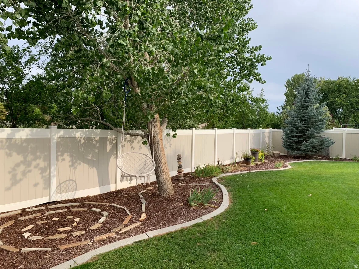 View of fenced backyard