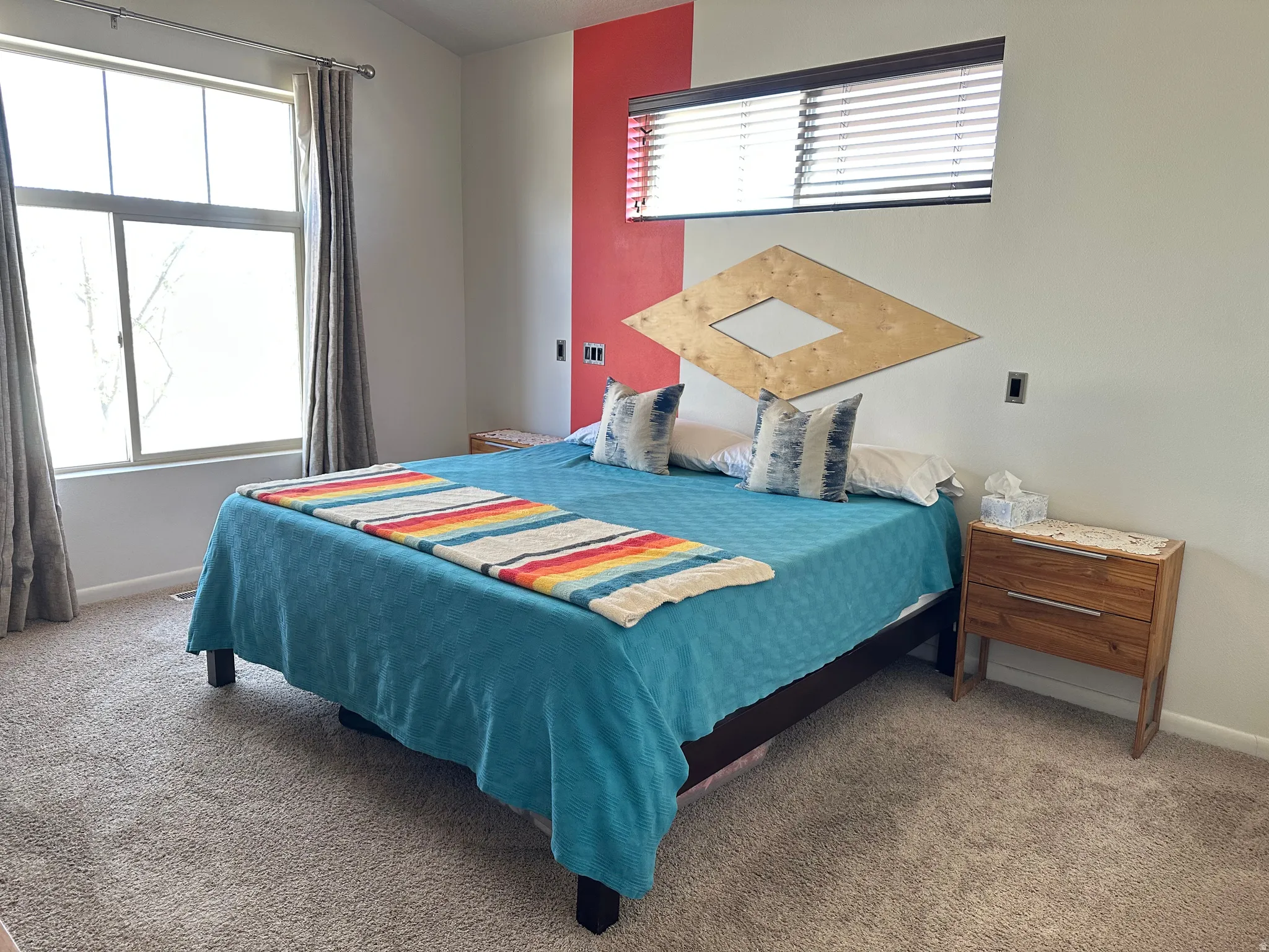Bedroom with baseboards and light carpet