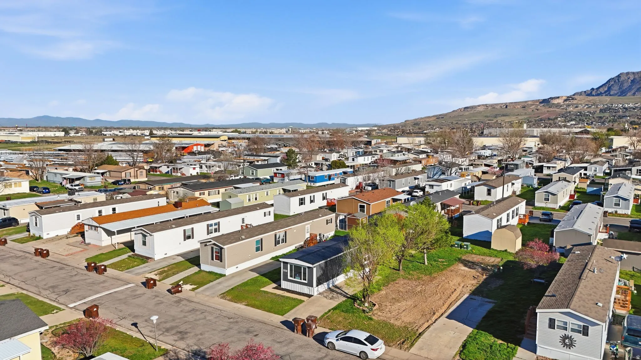 Aerial perspective of suburban area featuring a mountainous background