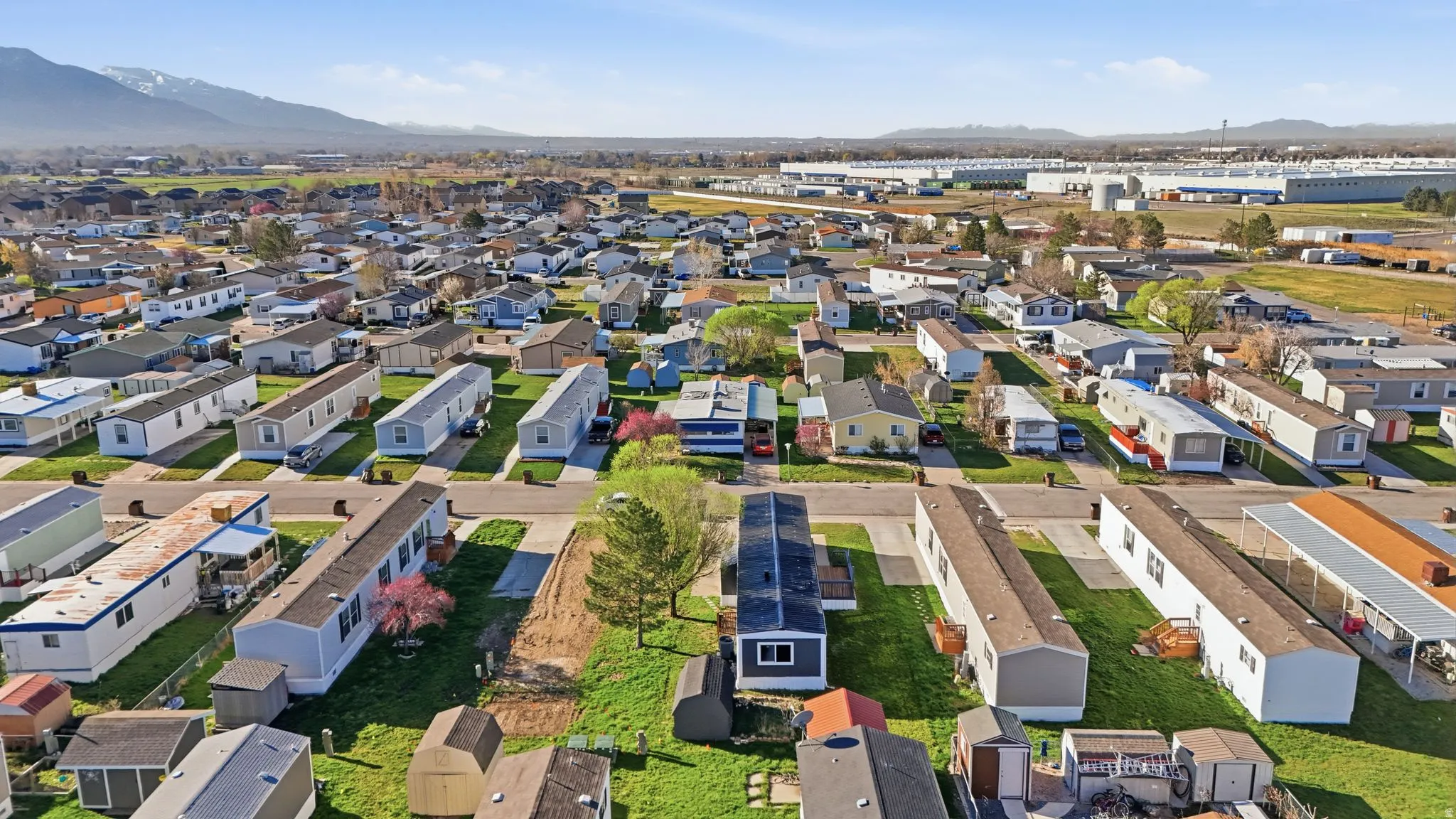 View of property location with a mountain backdrop and nearby suburban area