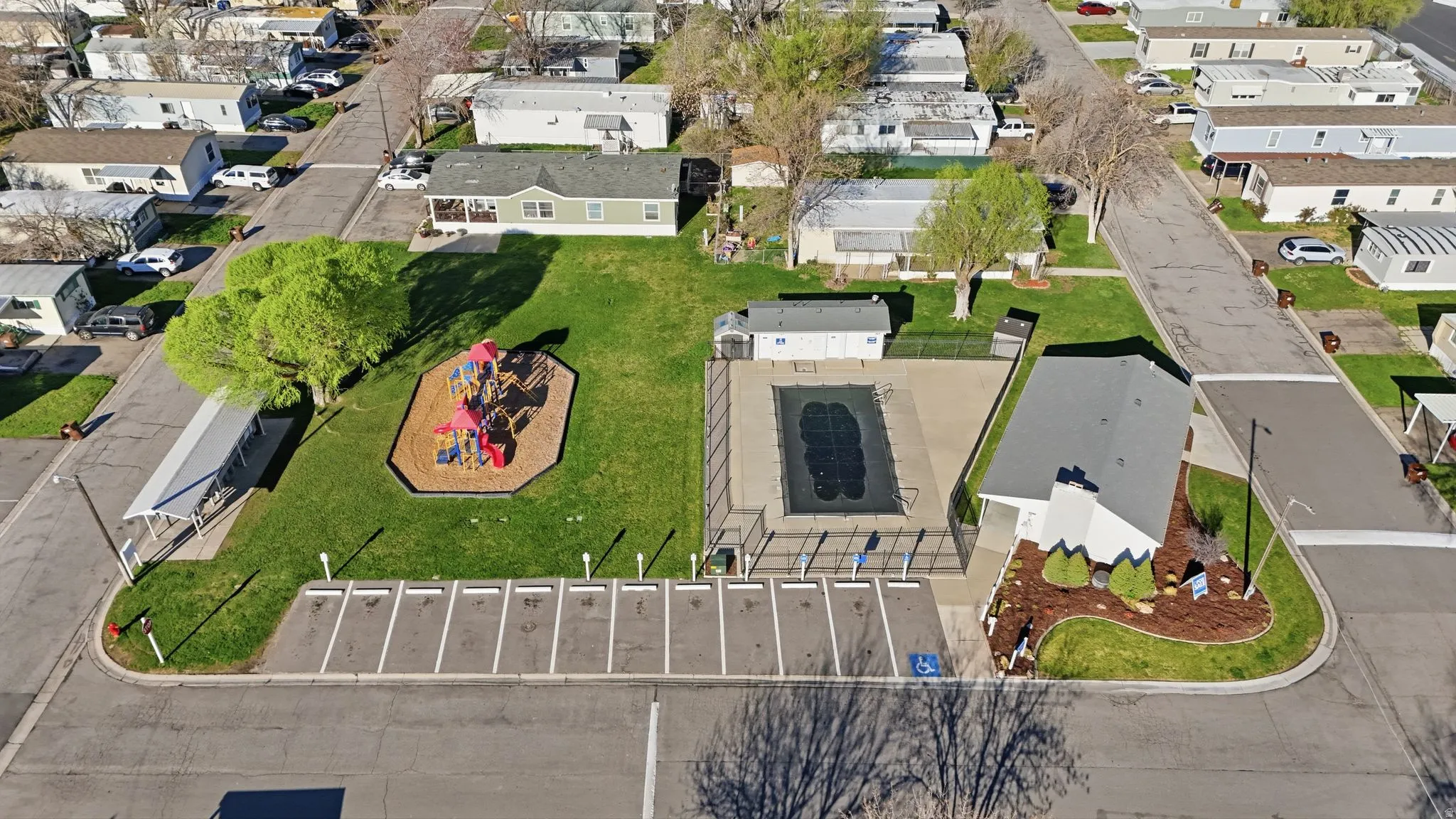 Aerial perspective of community pool and playground
