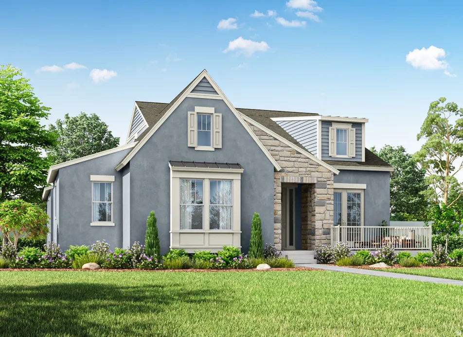 Tudor-style house with a front yard, stone siding, and stucco siding