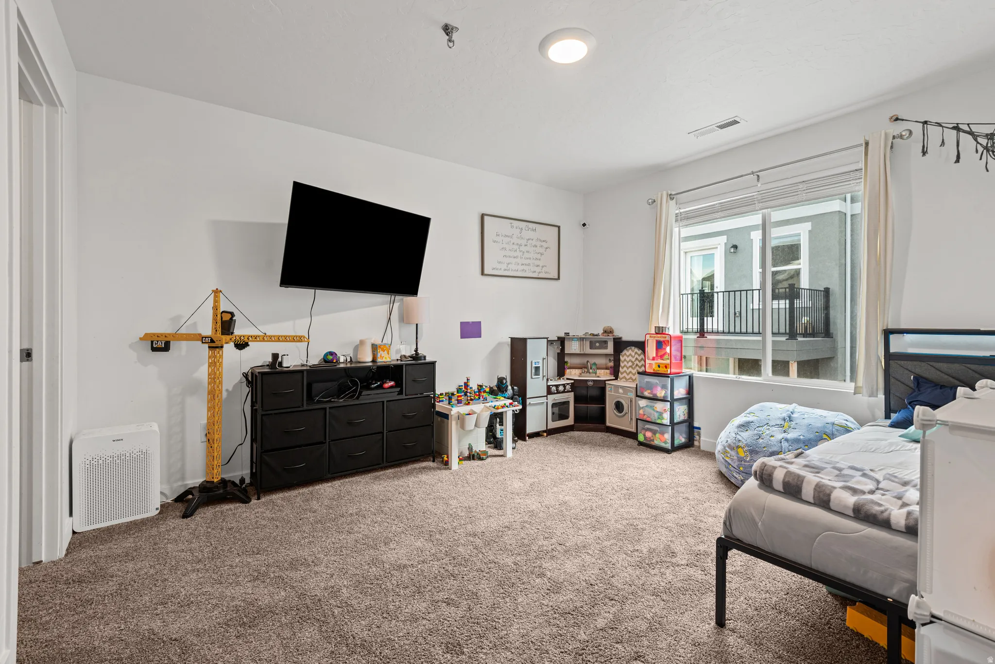 Carpeted bedroom with baseboards