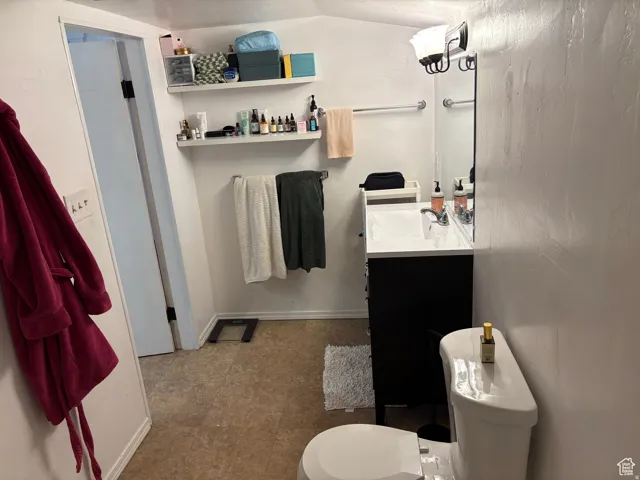 Full bathroom with vanity and toilet