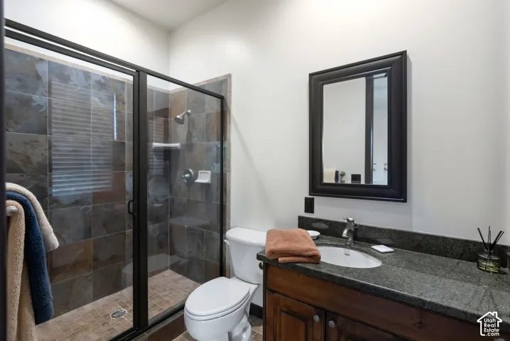 Bathroom with vanity and a shower stall