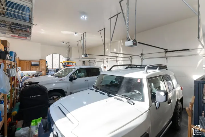 Garage featuring a garage door opener