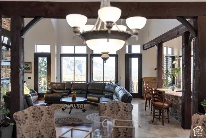 Living area featuring a high ceiling and arched walkways