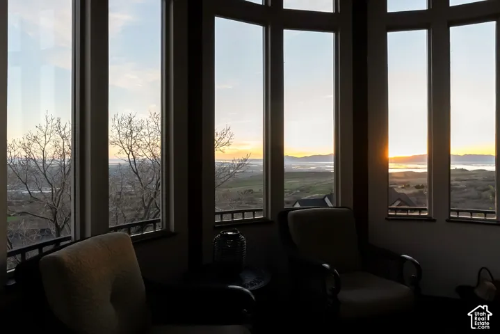 Sitting room with healthy amount of natural light and a mountain view