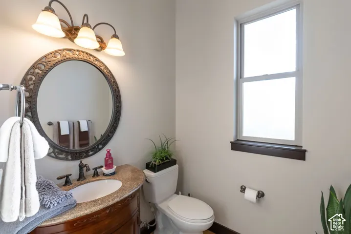 Bathroom featuring vanity and healthy amount of natural light
