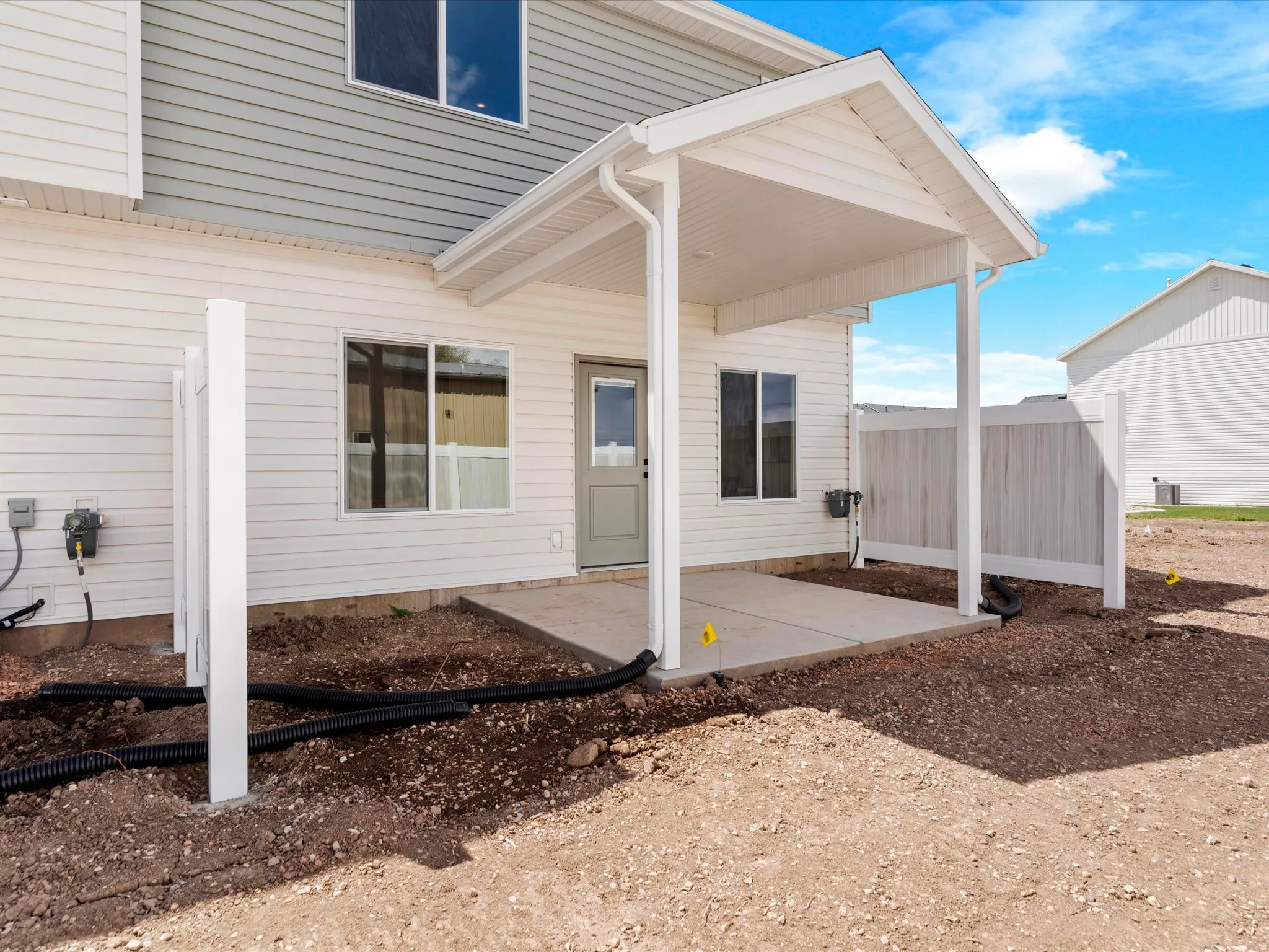 View of exterior entry featuring a patio