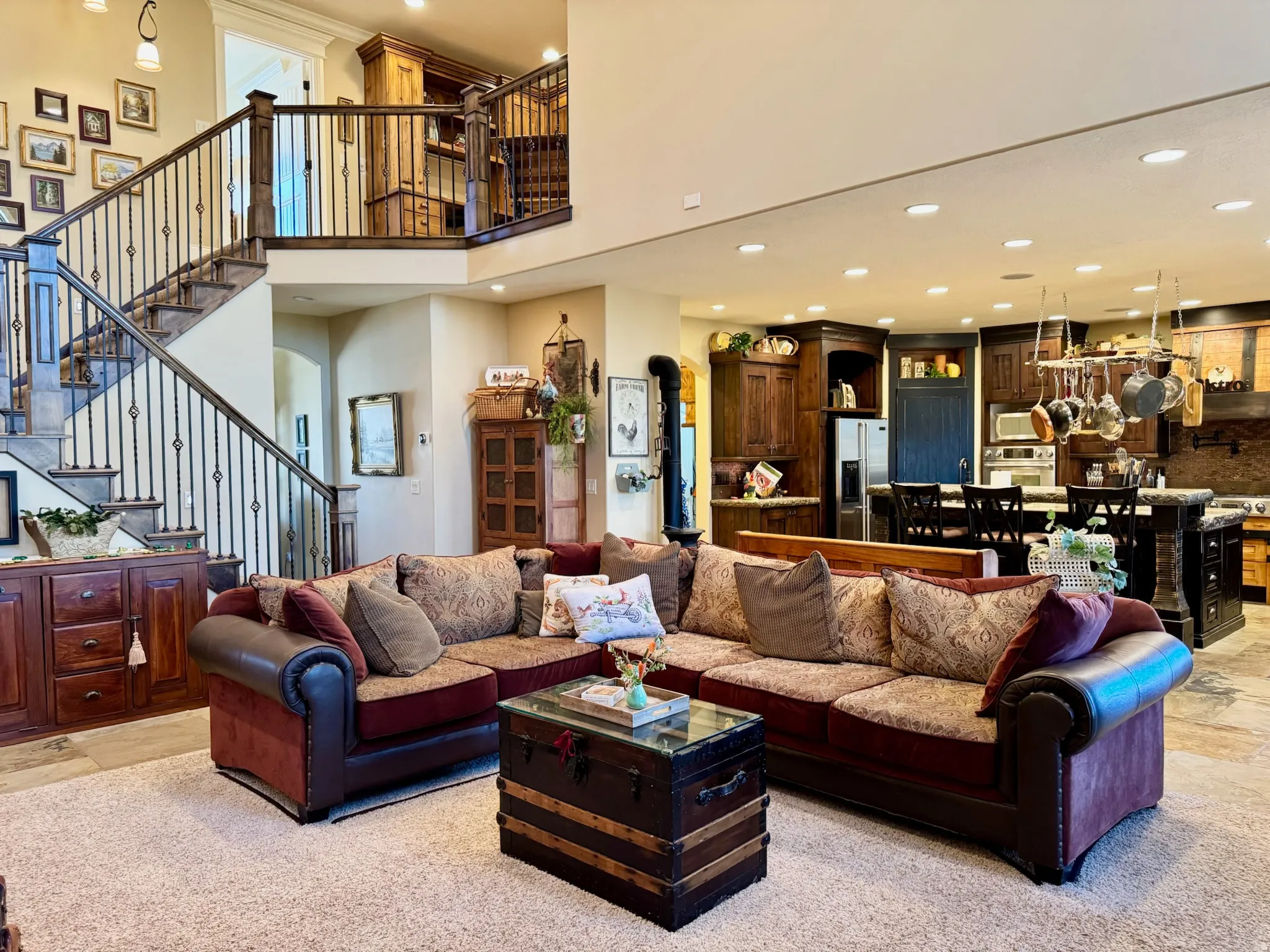 Living room with recessed lighting, a high ceiling, and arched walkways