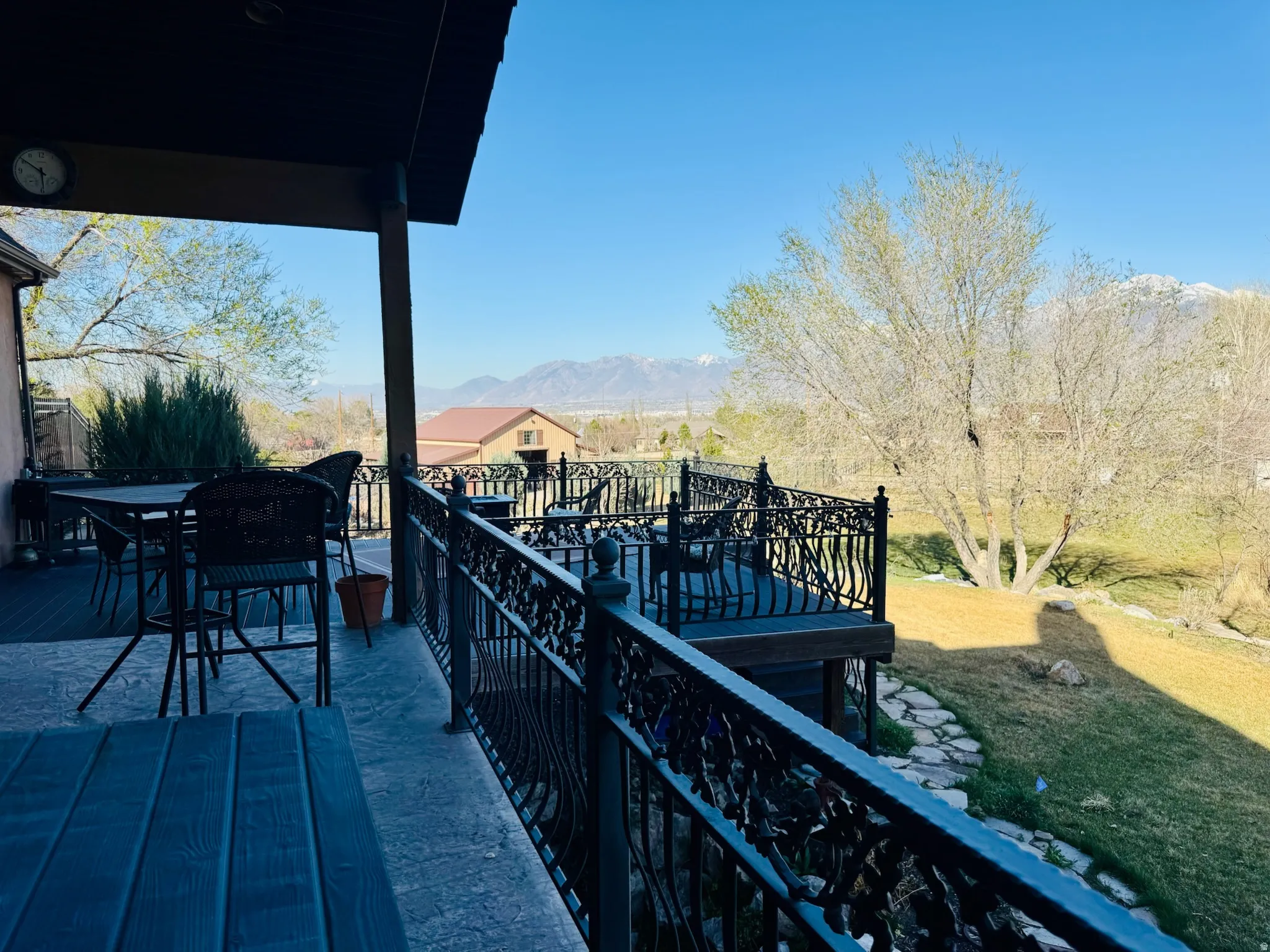Balcony with outdoor dining area and a deck with mountain view