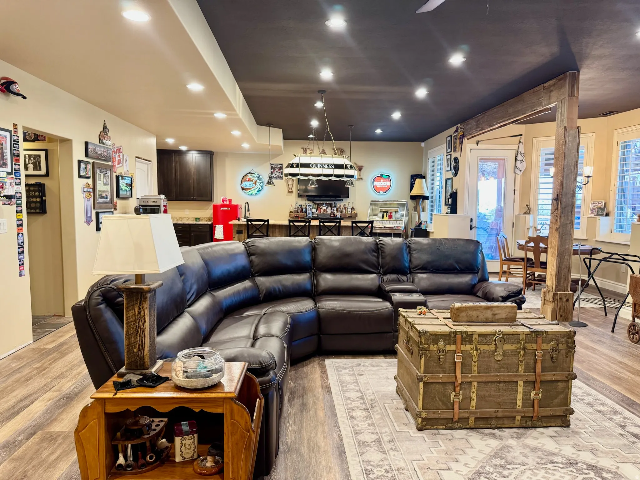 Living room with light wood-type flooring and recessed lighting