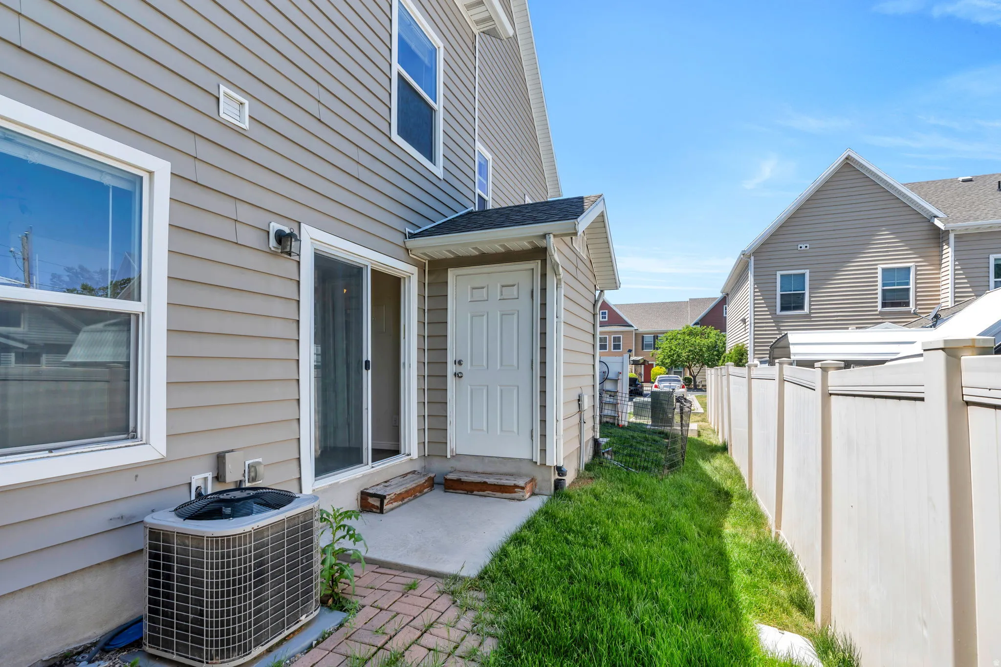 Exterior rear of the property featuring horizontal siding