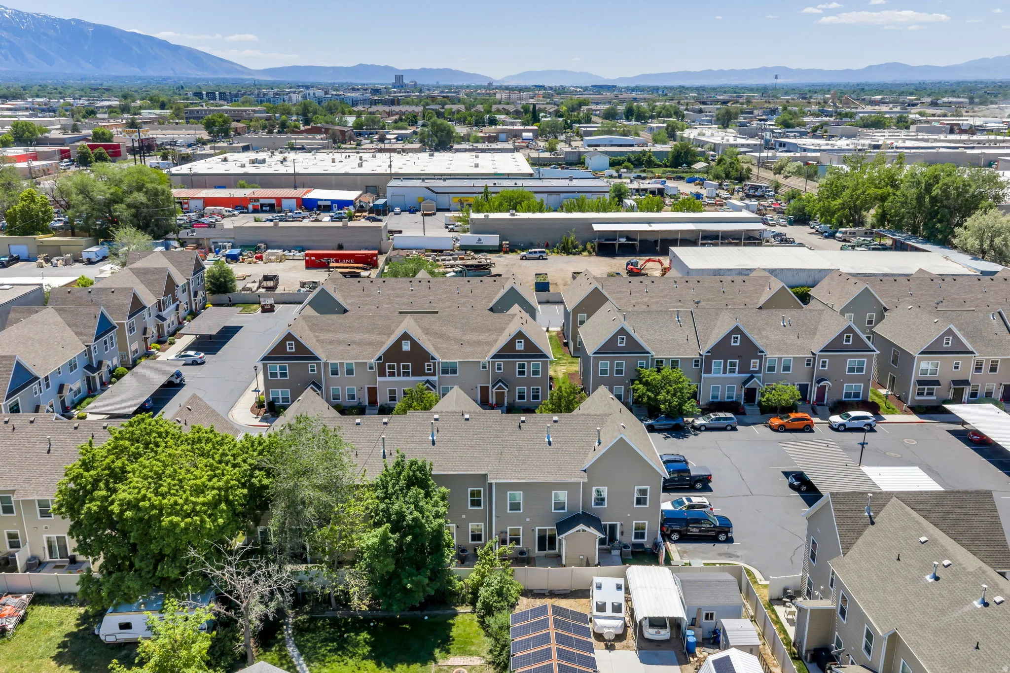 Townhome community featuring multi-story residences with gabled roofs and individual entrances